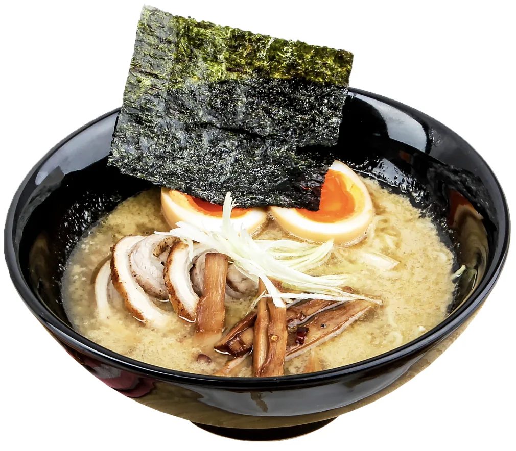 A bowl of tonkotsu ramen with chashu pork, ramen egg, spring onion, and nori